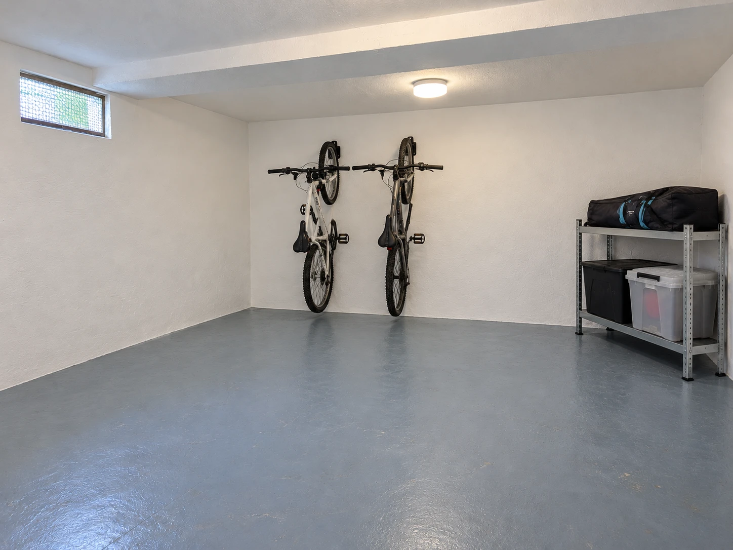 Dry, clean storage room with bikes hung on the wall